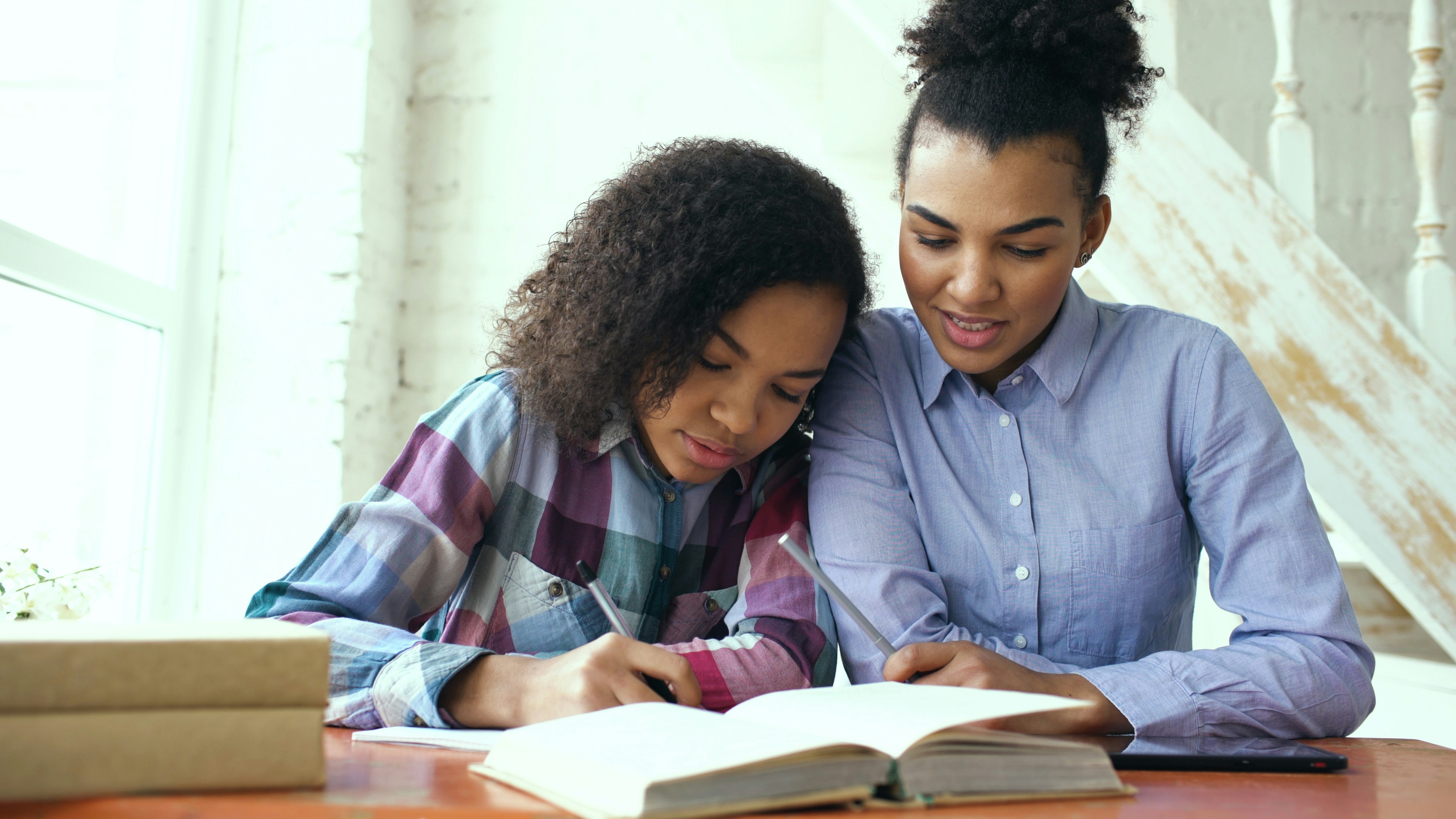 CLC Education tutor helping student with focused one-on-one learning session in South Africa